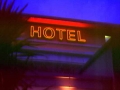 Hotel black trough lettering with outline neon lettering