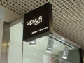 Illuminated double-sided projecting sign Remus Uomo