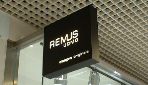 Remus Uomo illuminated projecting sign